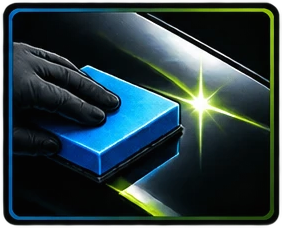 Gloved hand applying ceramic coating with a blue applicator pad
