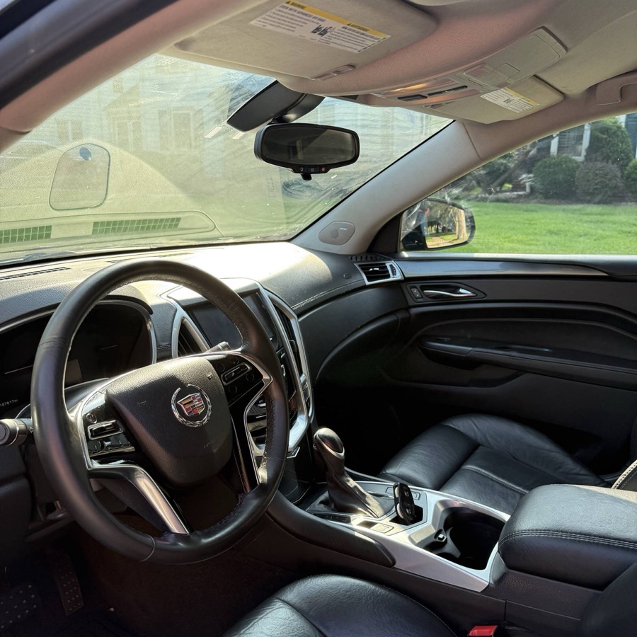 Spotless detailed leather interior and dashboard of a Cadillac