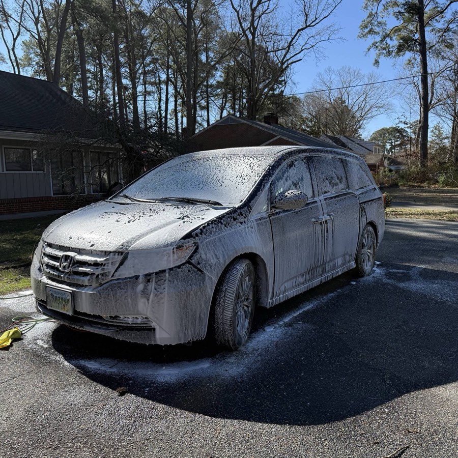 Honda Odyssey minivan covered in thick snow foam pre-wash
